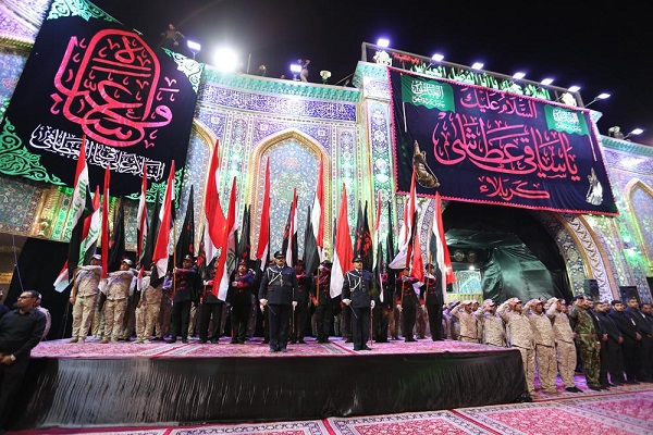 تصاویری از  پرچم عزای حسینی بر فراز گنبد ائمه(ع) در عراق