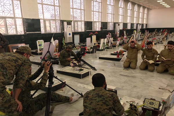 العراق: إنتاج فيديو كليب لتلاوة جماعیة لقراء الحشد الشعبي + صور