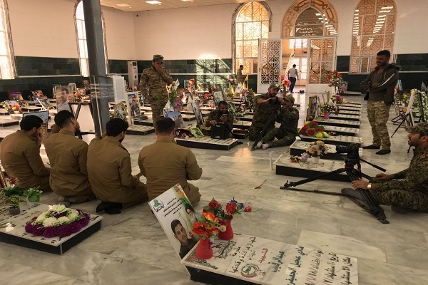 العراق: إنتاج فيديو كليب لتلاوة جماعیة لقراء الحشد الشعبي + صور