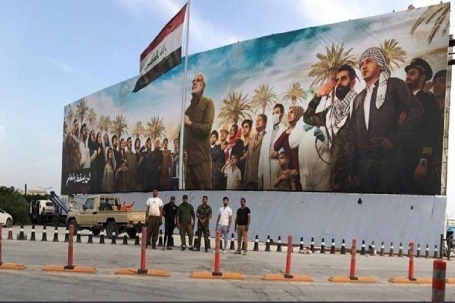 بالصور: أكبر جدارية في مطار بغداد الدولي بصورة الشهيد المهندس