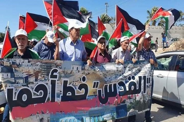 بالصور والفيديو...مسيرة أعلام فلسطينية في مدينة أم الفحم