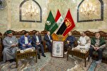 خطاطون إيرانيون يهدون نسخة خطّية من المصحف إلى العتبة العباسية + صور