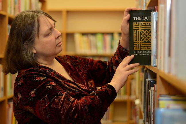 Pelham Public Library public services co-ordinator Elaine Anderson places a copy of the Qur'an back on a shelf after discussing diversity and understanding others. Pelham Public Library public services co-ordinator Elaine Anderson places a copy of the Qur'an back on a shelf after discussing diversity and understanding others.