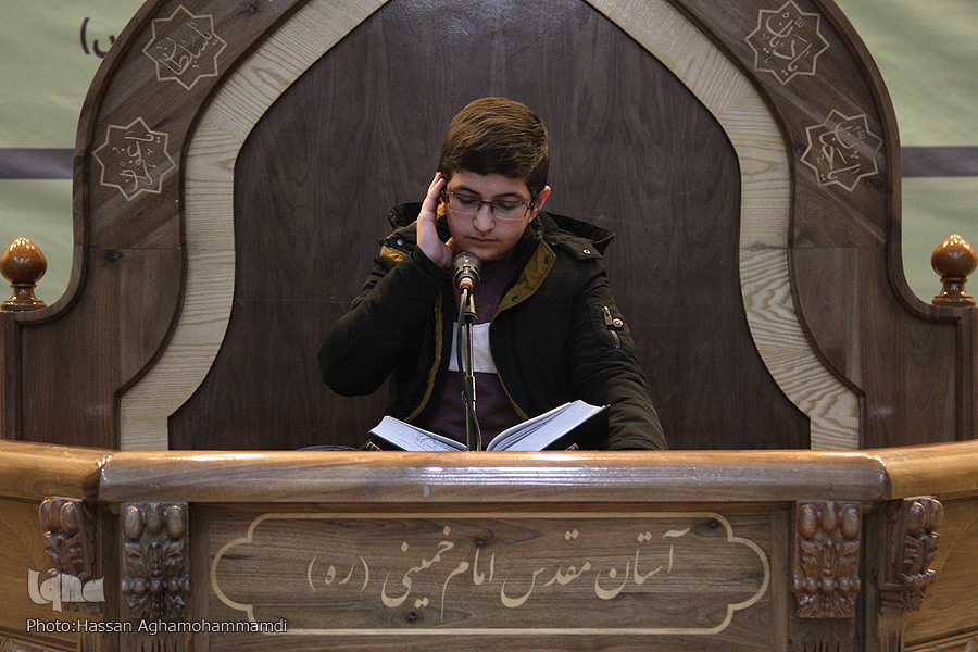 A student attending a local Quranic competition in Tehran 