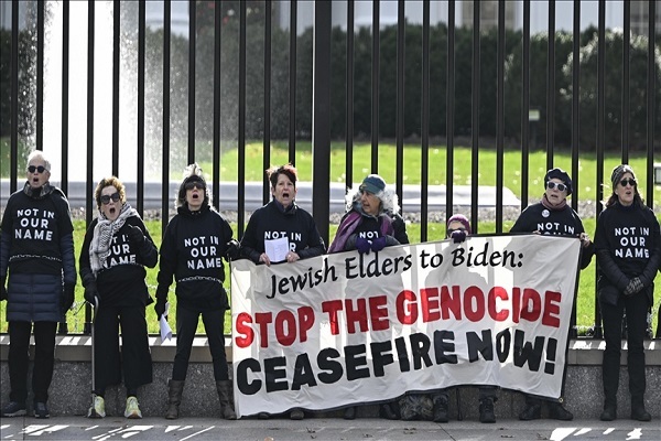 A group of Jewish Elders chain themselves to the White House perimeter fence Monday in protest of Biden's policies during the war in the besieged Gaza Strip