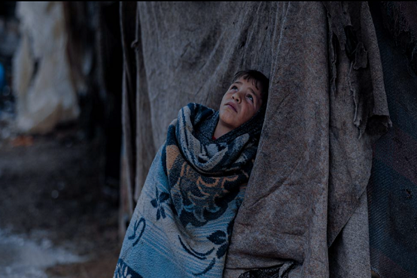 A child suffering from cold weather in winter