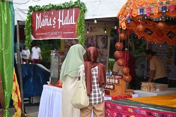 Filipinos visit a booth at the Halal Food Festival in Manila on Oct. 11, 2023