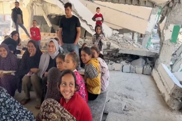 Girls and women gather in destroyed buildings in Gaza to learn the Quran
