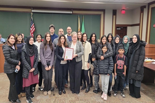 Mayor Nicole Gillespie (center), Shahrukh Mirza, president of Moorestown Muslims (left of Gillespie) and members of that group gathered at council’s Dec. 16 meeting recognizing Muslim Heritage Month.