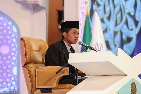 A participants in the 8th international Quran competition for school students in Tehran