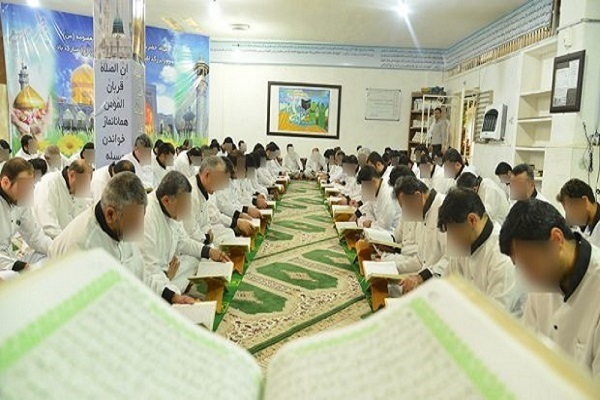 Inmates learning the Quran at a Dar-ol-Quran center in an Iranian prison