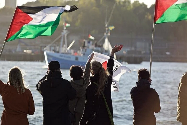 People waving Palestinian flags