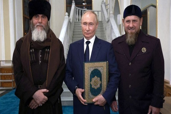 Russia's President Vladimir Putin (C) poses with the head of the Chechen Republic Ramzan Kadyrov (R) and Mufti of Chechnya Sheikh Salah-Hadzhi Mezhiev (L) during his visit to Chechnya in Grozny on August 20, 2024.