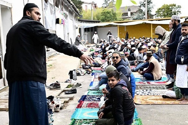 Muslims gather on the private parking lot of a construction site for prayer in Monfalcone, Italy on April 26, 2024