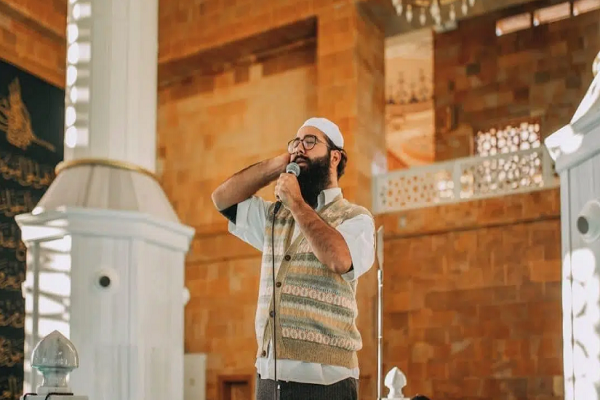 A man reciting Adhan (call to prayers)