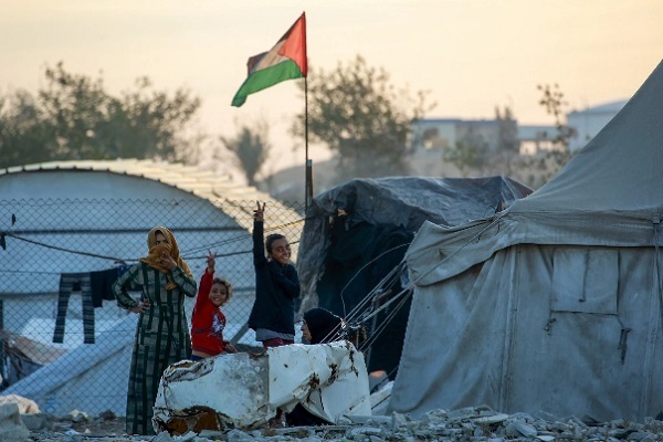 Palestinians in Gaza show sign of victory.