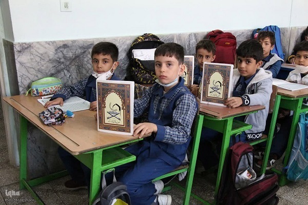 Students learning Quran at a school in Iran