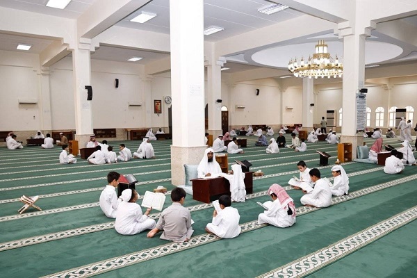 Children learning Quran at a mosque in Qatar