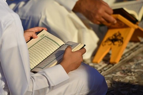 Muslims reading the Quran
