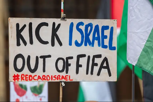 A banner calling for Israel’s expulsion from FIFA