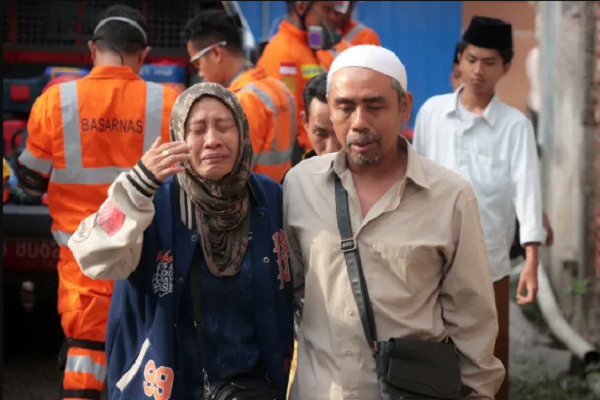 Parents anxious to hear about their children trapped under the rubble as rescue work is underway at Al Khoziny school in Indonesia after part of the building collapsed on September 29, 2025.