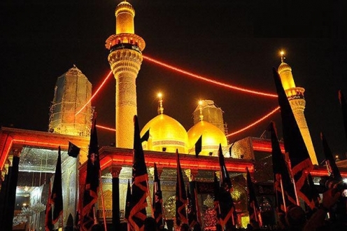 مراسم نصب پرچم سیاه روی گنبد امامین جوادین(ع) برگزار شد