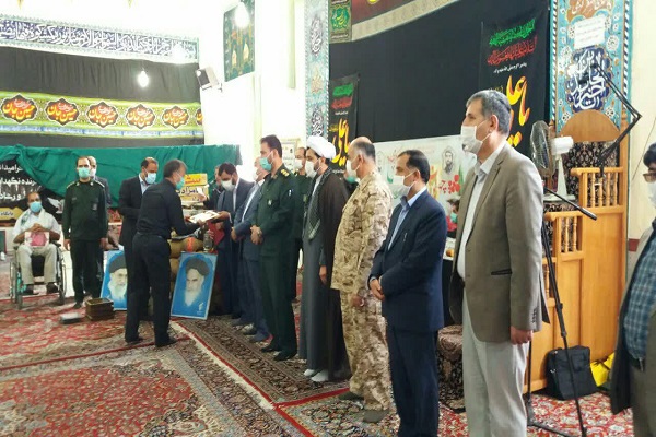 ادای احترام فرماندار ملایر به کادر درمانی و ایثارگران دفاع مقدس