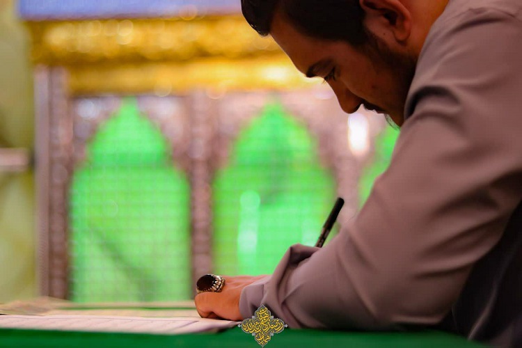 اتمام کتابت قرآن به یاد 8 هزار شهید همدان