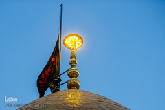 برافراشتن پرچم حرم امام حسین (ع) بر گنبد کربلای ایران