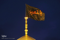 ⁨تعویض پرچم گنبد بارگاه حضرت معصومه(س)