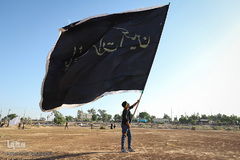 مراسم نمادین خاکسپاری شهدای کربلا در حمیدیه