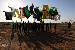 مراسم نمادین خاکسپاری شهدای کربلا در حمیدیه