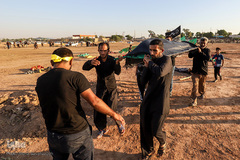 مراسم نمادین خاکسپاری شهدای کربلا در حمیدیه