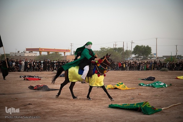 آیین نمادین خاکسپاری پیکرهای شهدای کربلا در حمیدیه