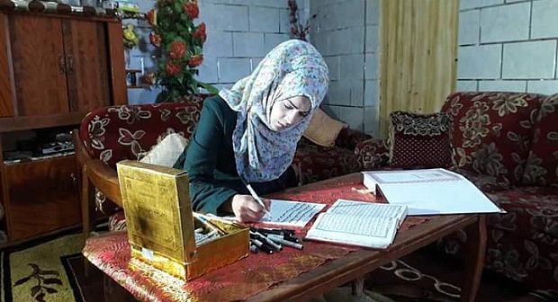 Le Coran manuscrit par une jeune palestinienne+photos