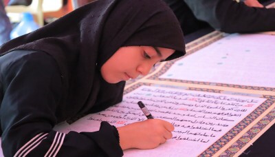 Rédaction du Coran par les pèlerins de l'imam Hussein (as)