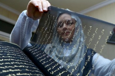 Kur'an-ı Kerim'i ipek sayfalara yazdı Kur'an-ı Kerim'i ipek sayfalara yazdı