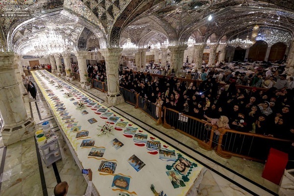 İmam Ali (a.s) türbesinde dünyanın en büyük pastası dağıtıldı