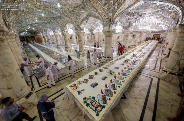 İmam Ali (a.s) türbesinde dünyanın en büyük pastası dağıtıldı