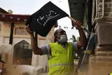 پویش نصب و توزیع  ۲۰۰۰ پرچم عزاداری امام حسین(ع) در گرگان برگزار شد