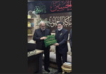 حرم امام حسین (ع) کا پرچم اور رھبرمعظم کی تشیع