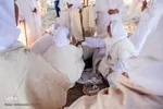 مراسم غسل تعمید منداییان در کنار رودخانه کارون