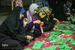 آماده‌سازی لباس همایش جهانی شیرخوارگان حسینی
