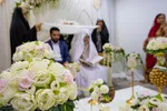 برگزاری مراسم عقد ازدواج جمعی از جوانان، به‌مناسبت ولادت باسعادت امام حسن مجتبی(ع)