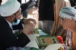 ایستگاه‌های قرآنی؛ پذیرای زائران عراقی اربعین + عکس