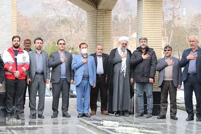 غبارروبی گلزار شهدای ملایر هم‌زمان با روز بزرگداشت شهدا