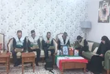 پرچم جلسات خانگی قرآن به خانواده شهید محمد محمدی زرین‌چقا اهدا شد