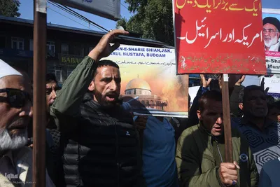 Kashmiri Muslims hold placards as they chant slogans against Israel and the U.S. during a protest against Israel's military operations in Gaza, on October 13, 2023, in Budgam, west of Srinagar, Indian-administered Kashmir, India. (Photo by Mubashir Hassan, IQNA)