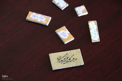 خوشنویسی که هنرش با ذره‌بین دیده می‌شود‎