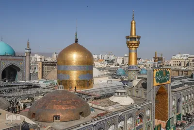 آیین تعویض پرچم گنبد حرم مطهر رضوی